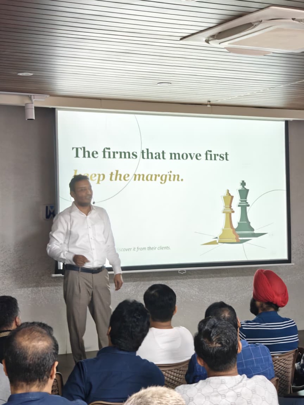 Jigar Joshi presenting the slide "The firms that move first keep the margin" at the AIMED Agentic Operating System workshop
