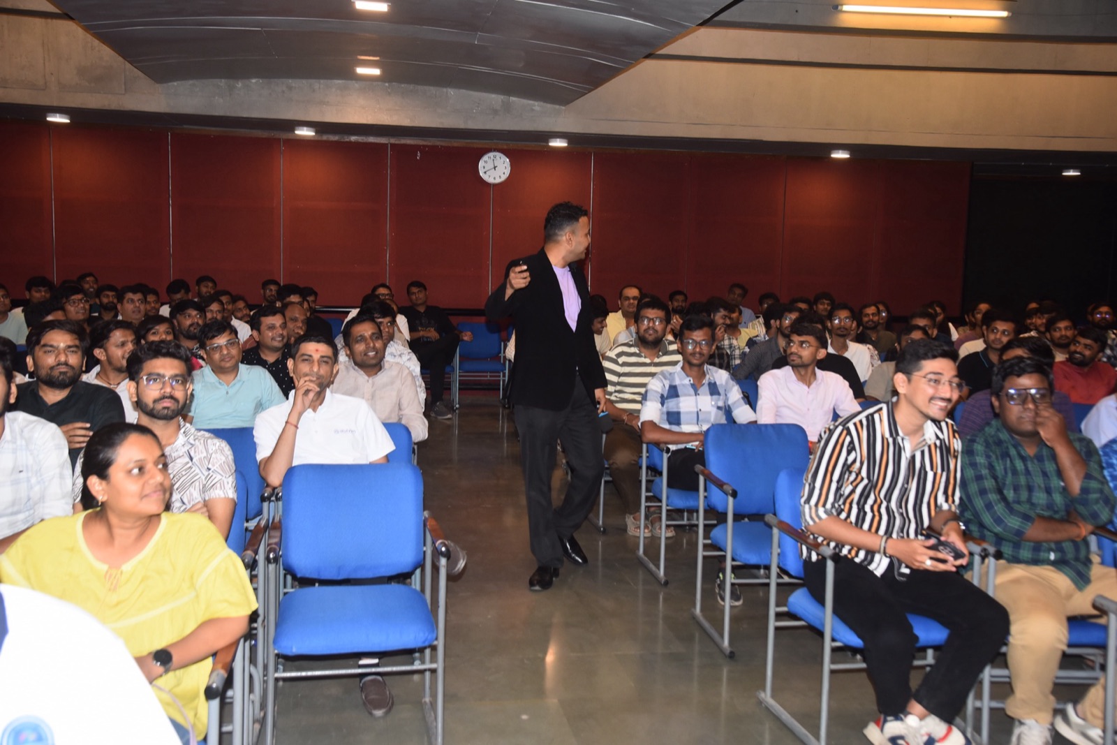 Jigar Joshi gesturing while engaging seated attendees at 11th DOT NET DAY by MDCA Ahmedabad